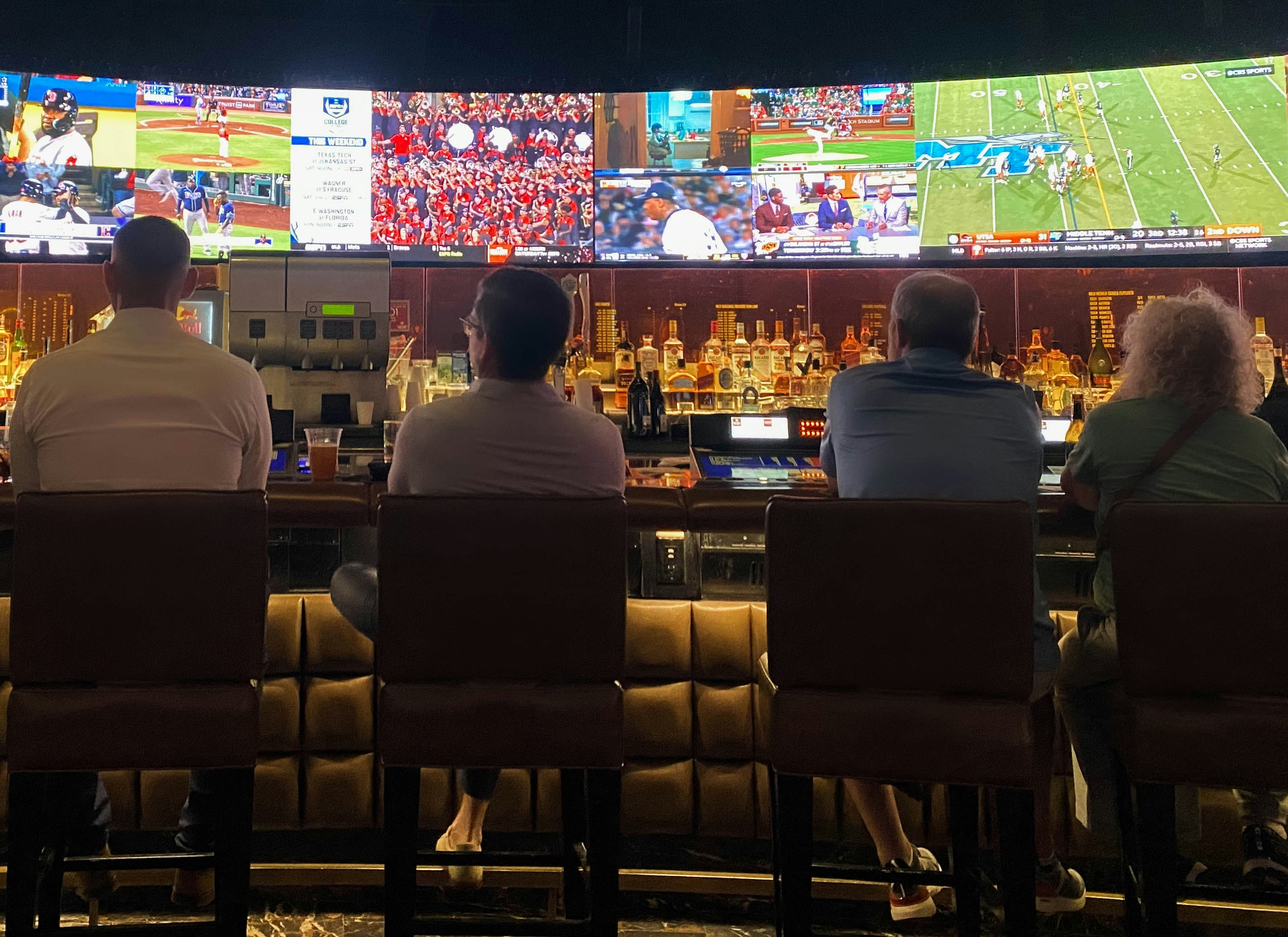 People watching sports at a bar